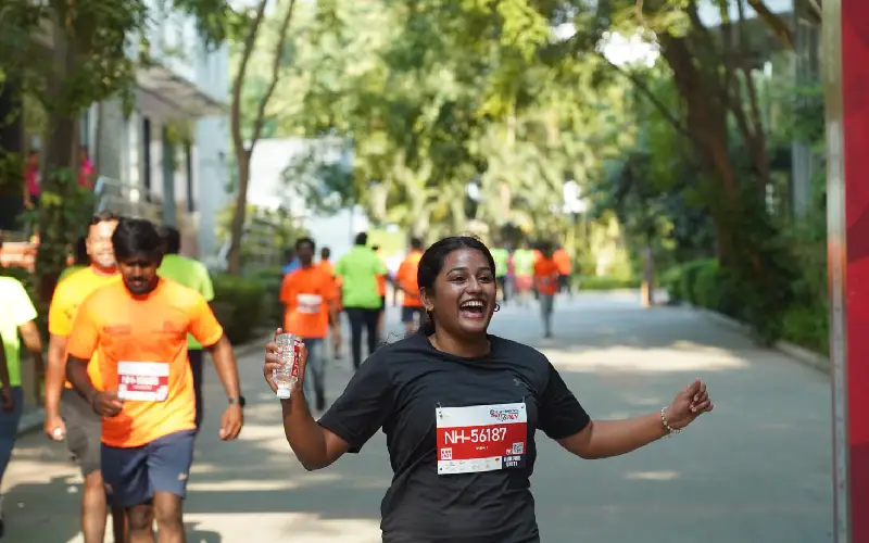 A runner finishes the marathon cheerfully